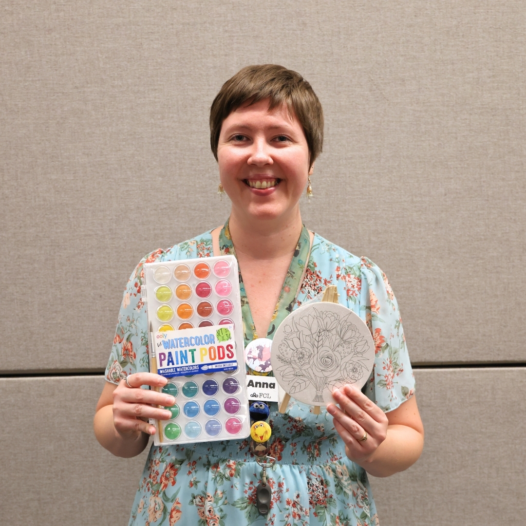 Anna Hay holding art supplies for FCL's Create and Connect program